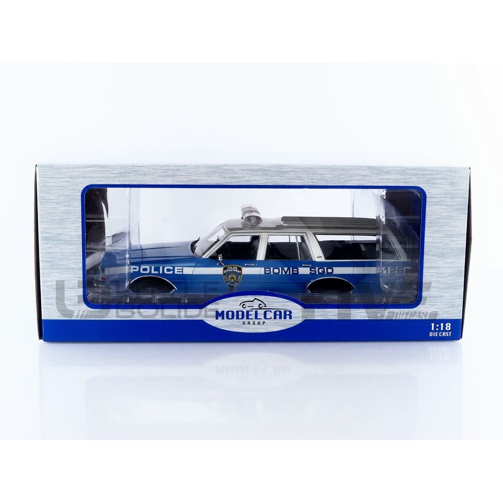 18477BL – MCG 1/18 - CHEVROLET Caprice Estate Wagon NYPD - 1985